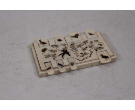 A Japanese Meiji period ivory shibayama cribbage scorer, 9cm