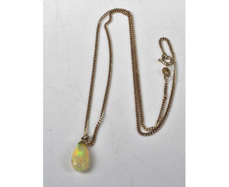 A modern polished opal pendant, weighing approx 3 carats, on finelink silver neck chain