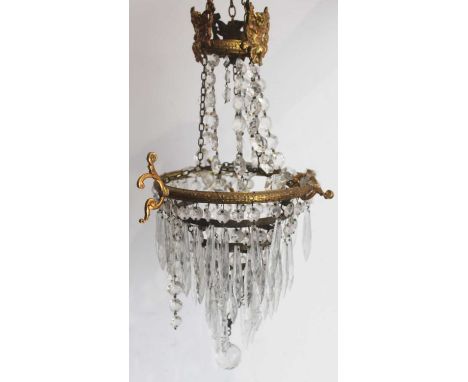 An early 20th century gilt metal five-tier ceiling light pendant, with glass prism dropsCondition report: Approx 23cm width. 