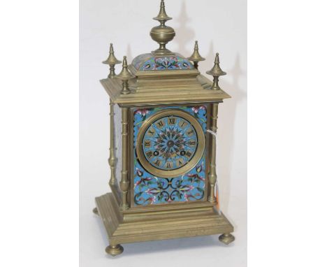 A 19th century brass cased and champleve enamelled mantel clock the domed enamel top with central finial with further finials