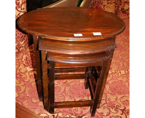 Mahogany nest of three tables along with two tripod tables and an assortment of prints and a cast iron table