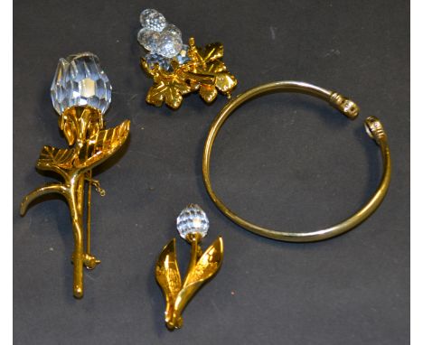 9ct yellow gold bangle plus three Swarovski brooches