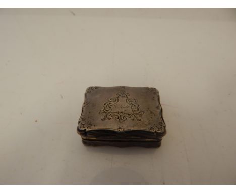 A rectangular silver snuff box with engraved armorial, maker D.P. Birmingham 1851