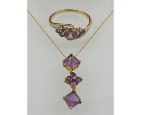 A 9 carat yellow gold and amethyst drop pendant, set two square cut amethysts with floral cluster between, together with a 9 