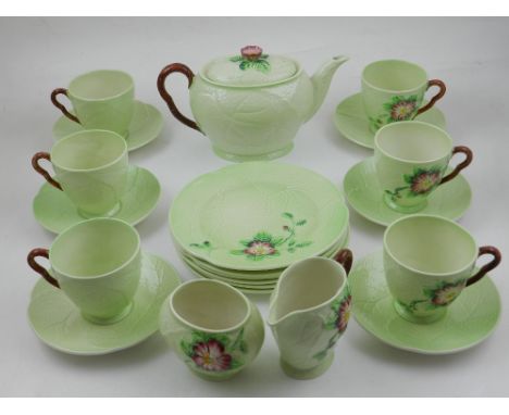 A Carltonware tea service, for six place settings comprising a teapot, sucrier, milk jug and sic cups, saucers and side plate