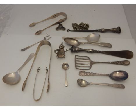 A small collection of 19th and early 20th century silver flatware including two pairs of suger tongs, a button hook and shoe 