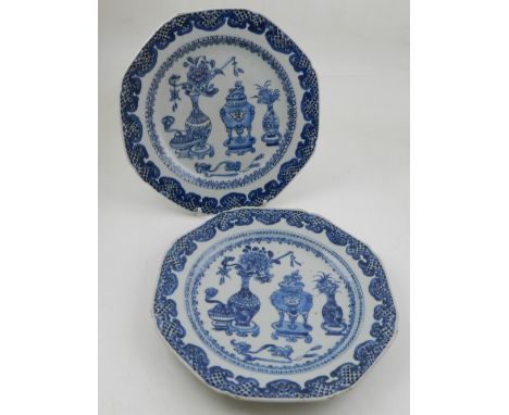 A pair of late 17th / early 18th century Chinese Kangxi period blue and white octagonal porcelain plates, both decorated cent