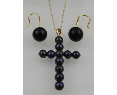 A 9 carat yellow gold and black pearl cross pendant, suspended on a 9 carat yellow gold chain, together with a pair of yellow