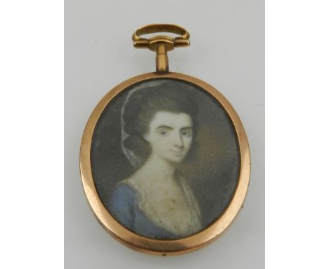 An early 19th century yellow metal mounted Momento Mori portrait miniature, having glass aperture to verso containing platted