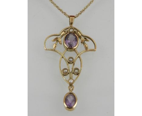 A 9 carat yellow gold, amethyst, and split seed pearl pendant, in the Art Nouveau style, suspended on a 9 carat yellow gold c