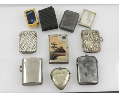 Ten assorted vesta cases including a heart shaped example with engraved decoration, another with fox hunting scene and a pain