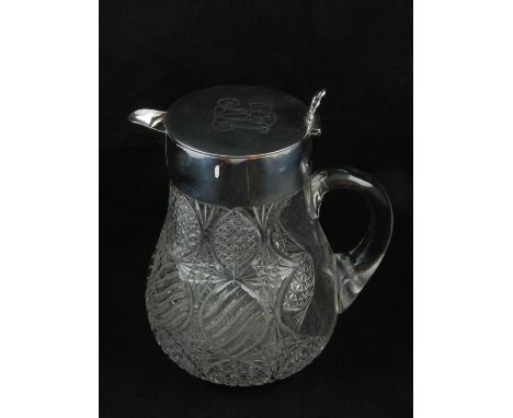 A large Victorian silver mounted glass pitcher, London 1896 by Drew & Son, the glass of cross hatched design the lid with eng