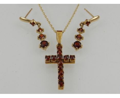 A 9 carat yellow gold and garnet cross pendant suspended on a 9 carat yellow gold chain, together with a pair of 9 carat yell