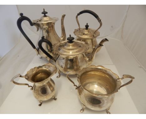 A George V  five piece silver tea and coffee service of baluster form comprising tea, water and coffee pots, cream jug and su