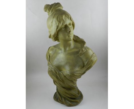 A late 19th century Goldscheider terracotta bust, the young woman look to the left wearing a flowering robe, H. 59cm.