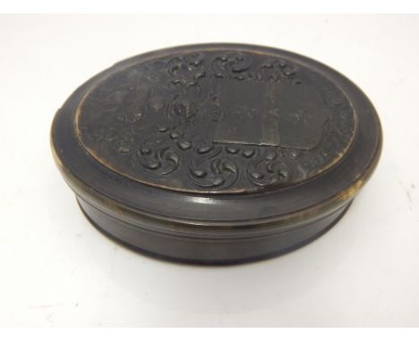 A 19th Century oval pressed horn snuff box commemorating Sir Francis Drake, the cover embossed with his armorial, h:10cm