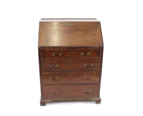 A George III style mahogany bureau, of small proportions, the fall front opening to reveal a serpentine interior arrangement 