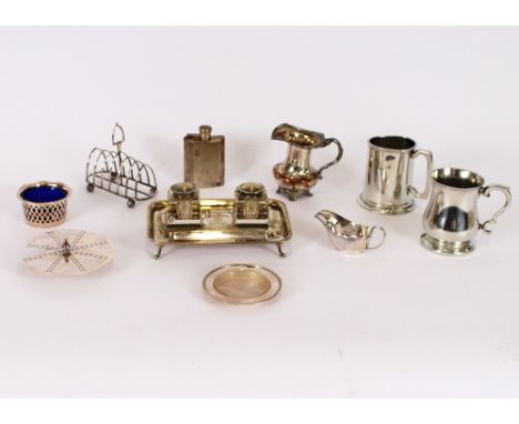 A silver plated desk stand; a toast rack; hip flask; two pewter tankards; a cake stand; and various other items