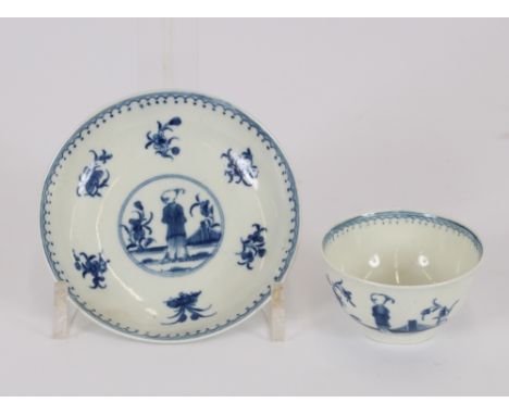 An 18th Century Worcester tea bowl, decorated with a Chinese figure amongst foliage