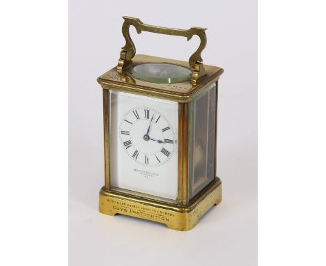 A brass cased carriage clock, of large size, retailed by Mappin Bros. of Cheapside, bearing inscription "With best wishes fro