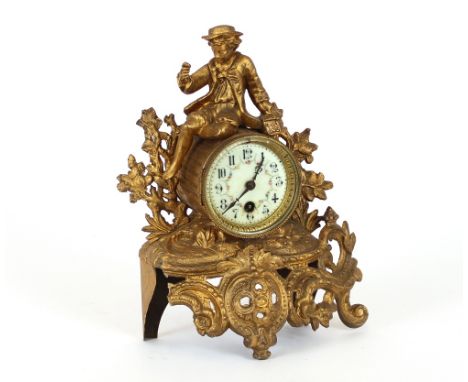 A 19th Century French gilded Spelter mantel clock, having figural and foliate decoration, 32cm high
