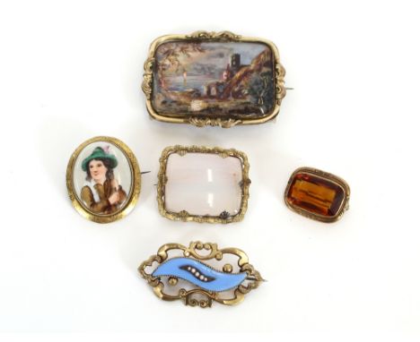 A Victorian yellow metal brooch, with mother of pearl decorated panel depicting a lake scene with castle ruins; and four vari