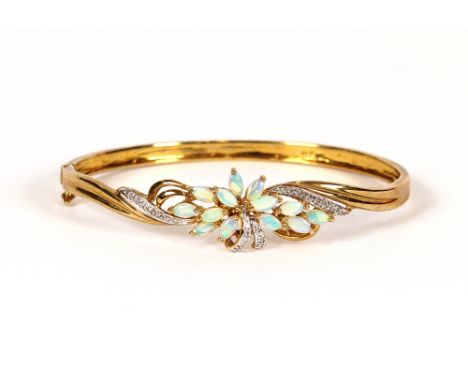 A 9 carat gold opal and diamond set snap bangle, 10.6gms total weight