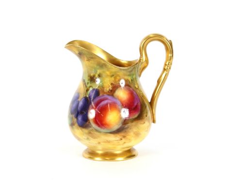 A Royal Worcester baluster cream jug, decorated with fruit, signed W.B., gilded handle and interior, circa 1927, 10cm high