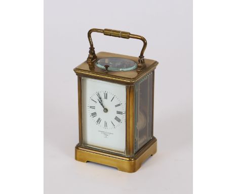 A brass cased carriage clock, retailed by Goldsmiths Company, Regent Street, London, white enamel Roman numeral dial, strikin