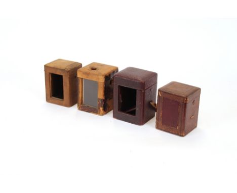 Four various carriage clock traveling cases