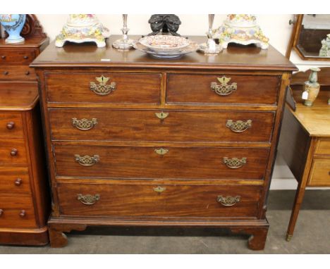 A George III mahogany chest, of two short and three long drawers within reeded angles, raised on bracket feet, 113cm wide