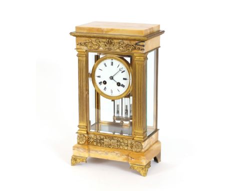 A marble and gilt metal four glass mantel clock, the circular Roman numeral dial supporting an 8 day movement striking on a g