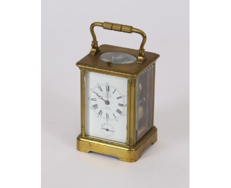 A brass cased carriage clock, retailed by J.W. Benson, Ludgate Hill, having striking repeat movement, white enamel Roman nume