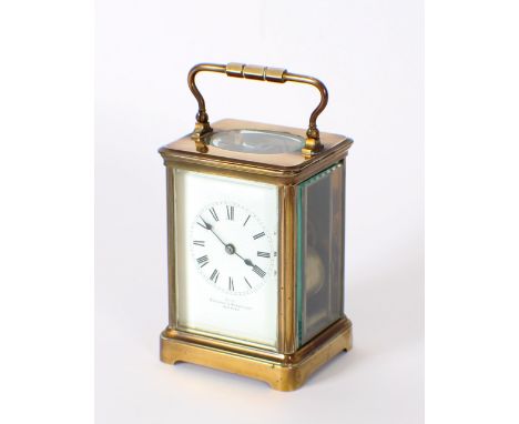 A brass cased carriage clock, retailed by Bracher & Sydenham, Reading, white enamel Roman numeral dial, striking movement, 18