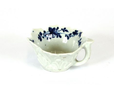 An 18th Century Worcester butter boat, having leaf moulded body and floral decoration, 7cm in extremes