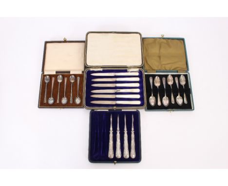 A cased set of six silver bladed and mother of pearl handled fruit knives; a cased set of six silver coffee spoons; a part ca