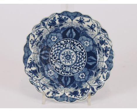 An 18th Century Worcester shallow dish, having scallop border and allover leaf pattern in segments, 7.5cm dia.