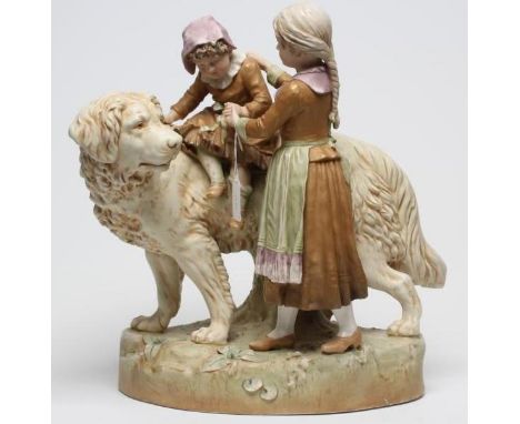 A ROYAL DUX FIGURE GROUP, early 20th century, a girl standing beside a large dog and holding her younger sister on its back, 