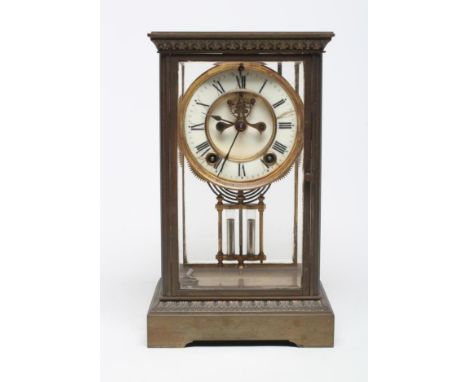 A BRASS FOUR GLASS MANTEL CLOCK, late 19th century, the twin barrel movement with compensating pendulum and striking on a gon