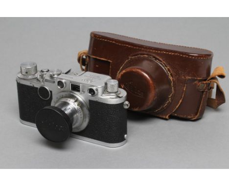 A LEICA D.R.P. ERNST LEITZ WETZLAR IIc CAMERA, with Leitz Elmar f=5cm 1:3,5 lens, leather case and manual (Est. plus 21% prem
