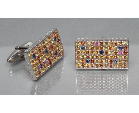 A PAIR OF SILVER CUFFLINKS, each oblong panel pave set with numerous multi-coloured sapphires, stamped 925 (Est. plus 21% pre