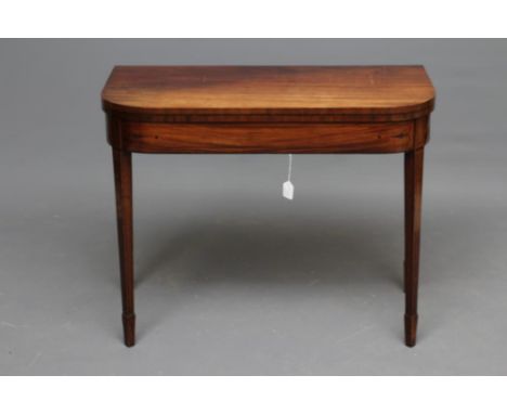 A GEORGIAN MAHOGANY FOLDING CARD TABLE, early 19th century, of rounded oblong form with ebony stringing, green baize lined, t