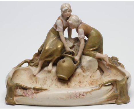 AN ART NOUVEAU ROYAL DUX FIGURAL SMALL CENTRE BOWL, early 20th century, the two young peasant girls filling a pitcher at a st