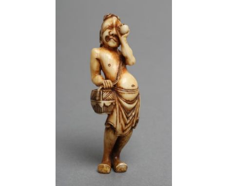 A JAPANESE IVORY NETSUKE, Meiji period, the pot-bellied egg tester peering at an egg and carrying a basket over his shoulder,