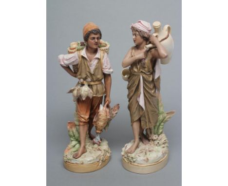 A RARE PAIR OF ROYAL DUX YOUNG ARAB STREET VENDORS, early 20th century, the male with a pannier of fruits on his back and car