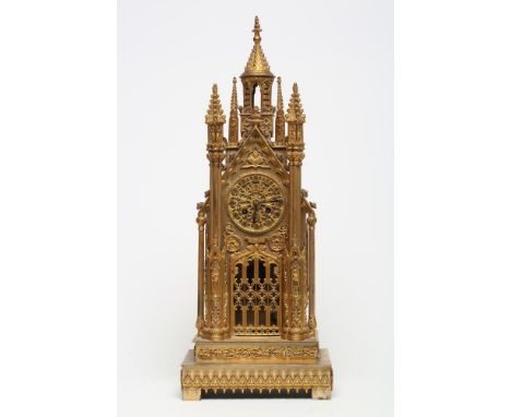 A FRENCH GILT METAL CATHEDRAL CLOCK, late 19th century, the twin barrel movement with outside count wheel and bell striking t