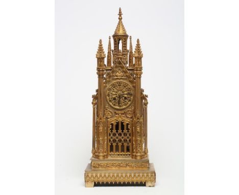 A FRENCH GILT METAL CATHEDRAL CLOCK, late 19th century, the twin barrel movement with outside count wheel and bell striking t