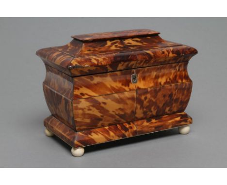 A VICTORIAN TORTOISESHELL TEA CADDY of sarcophagus form, the hinged lid opening to interior with two lidded compartments with