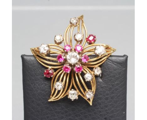 A DIAMOND AND RUBY OPENWORK FLOWER BROOCH, unmarked (Est. plus 21% premium inc. VAT)Unmarked and untested, vendor states 18ct