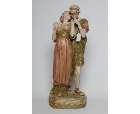 A ROYAL DUX FIGURE GROUP, early 20th century, the young man standing with his lover on a shaped base, model 1513, pink patch,
